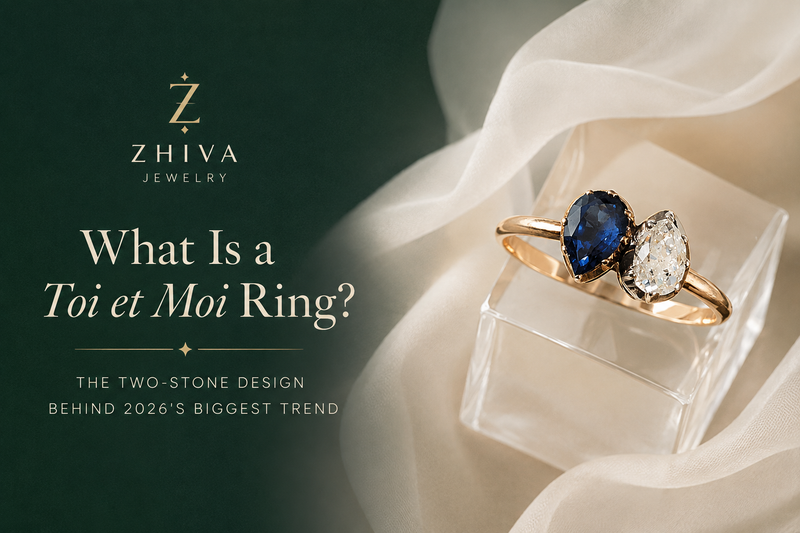 Gold toi et moi engagement ring with a pear blue sapphire and pear diamond set side by side.