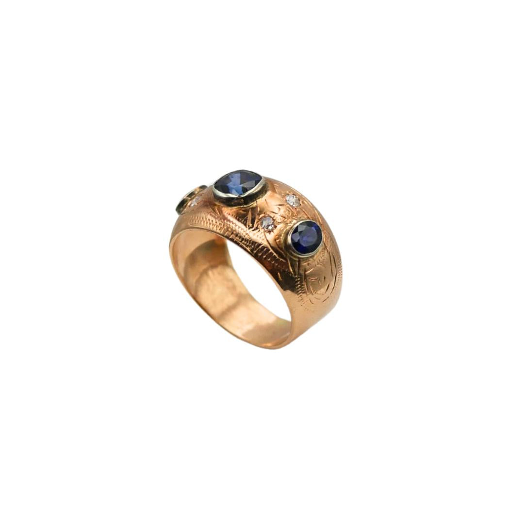Side profile of an antique sapphire and diamond gypsy-set 14k gold band.