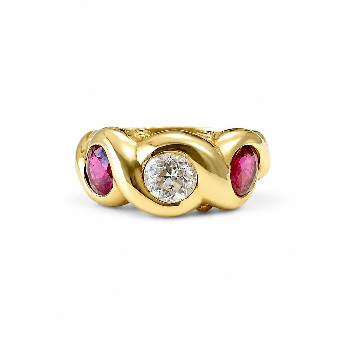 Vintage three-stone pinky ring: a transitional cut diamond between two rubies, bezel-set in 18k yellow gold, ZHIVA